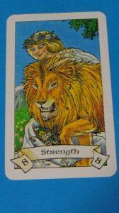 The Strength card from the Robin Wood Tarot deck